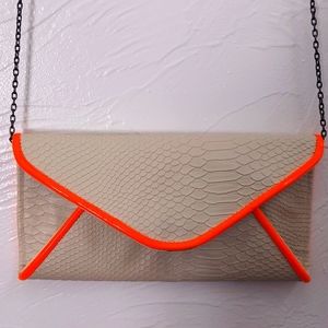 Remi & Reid cream handbag with neon orange trim